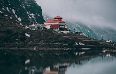 House and clouds and Tsongmo Lake on a Himalayas trek, Gangtok, Sikkim, India