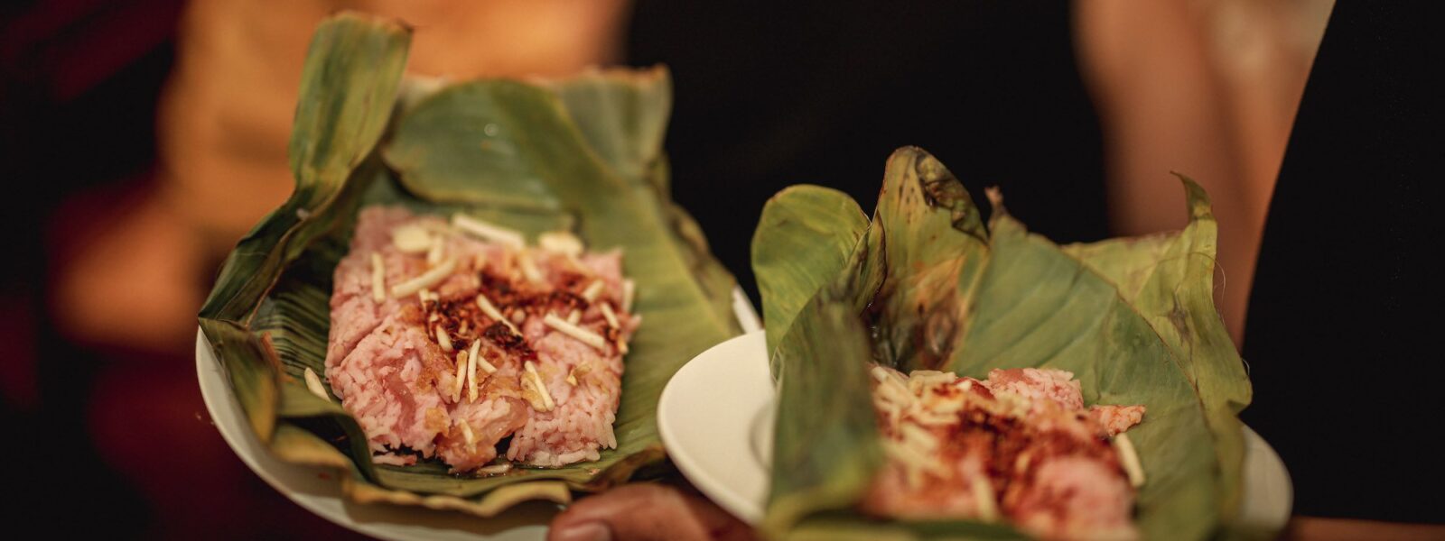 Sour pork and rice on banana leaves