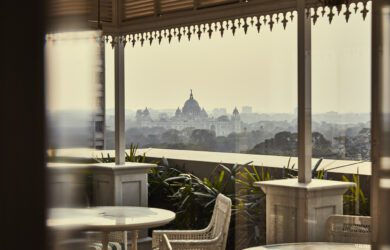 Victoria Memorial in Kolkata and terrace of the Glenburn Penthouse through the glass