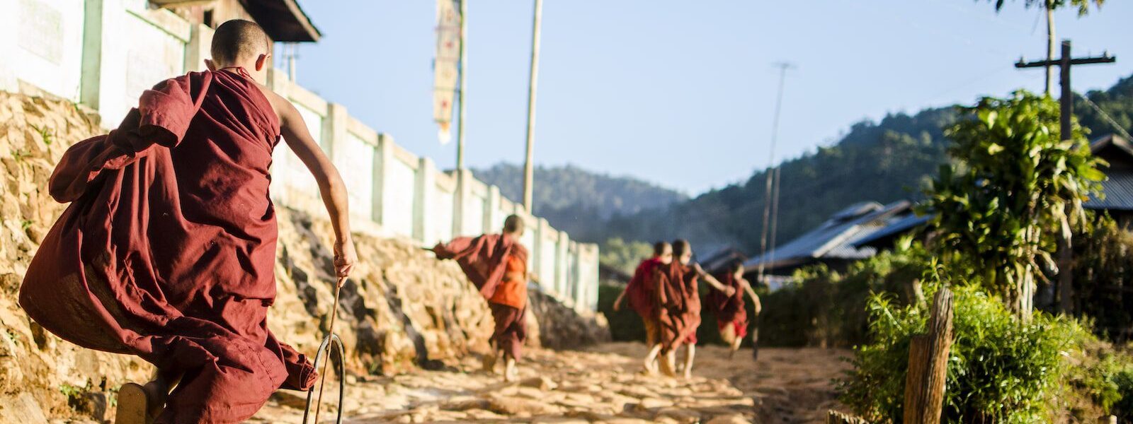 Novice monk running in Myanmar