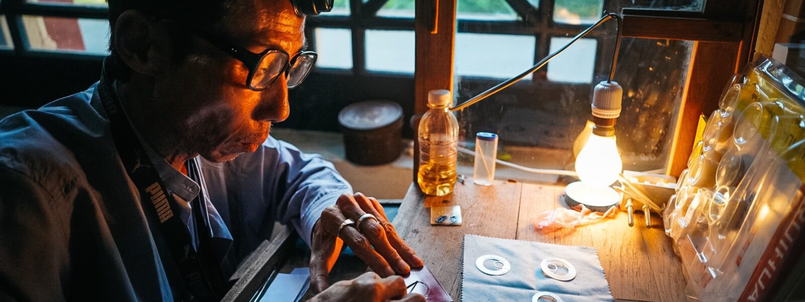 Watch expert assembling a watch